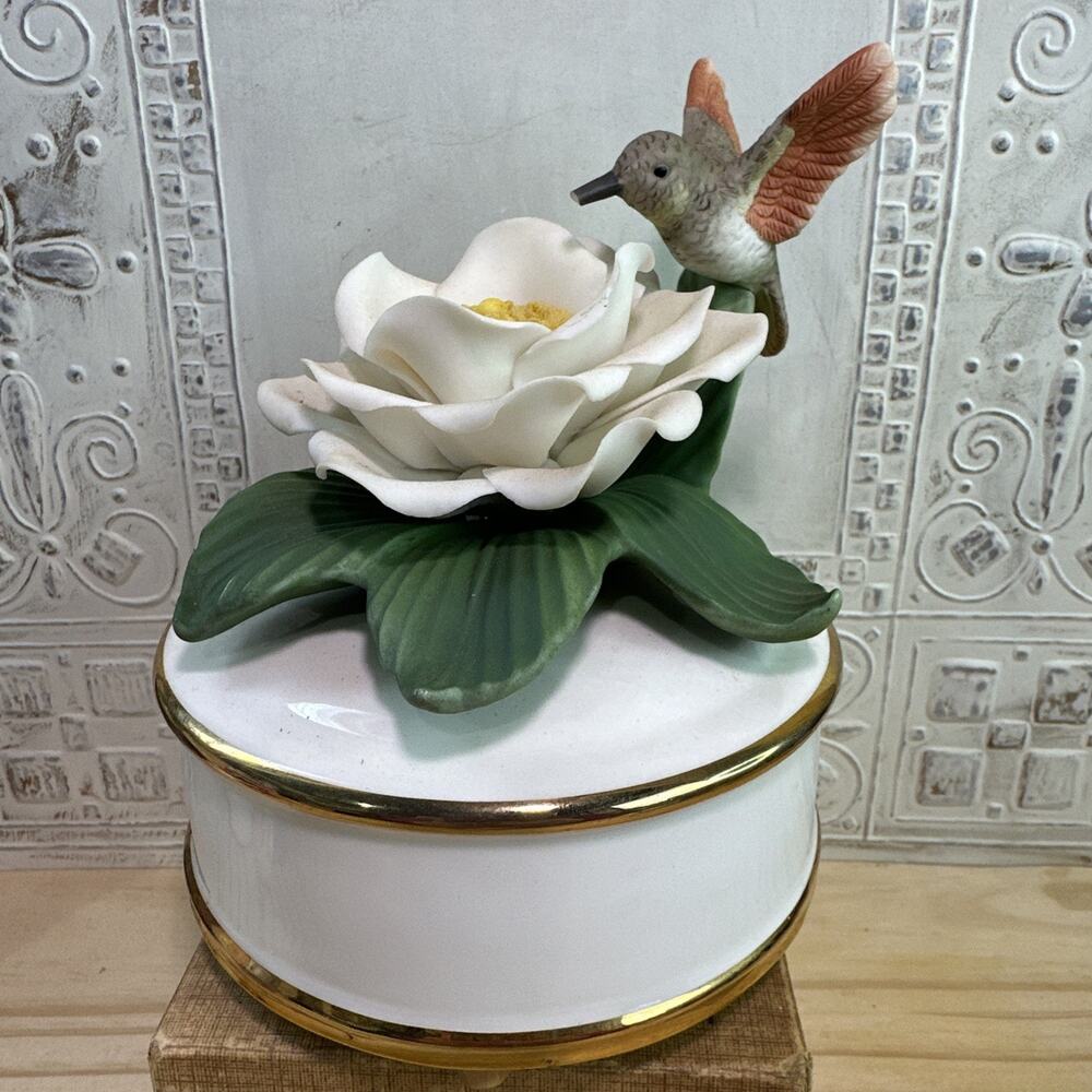 Vintage Teleflora Porcelain Humming Bird on Magnolia Flower Music Box 5" tall
